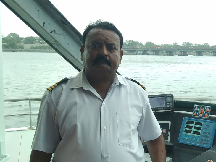 Captain Ashokbhai Bambhnia who operates the Akshar River Cruise.